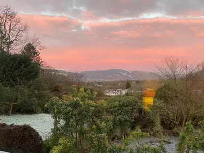 a view from the garden at sunset at Shelley Cottage in Keswick