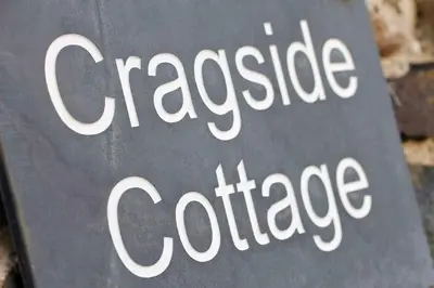 a sign that says casseroleoleole college at Cragside Cottage in Troutbeck