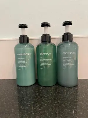 two bottles of soap sitting on top of a counter at Character cottage in centre of Moffat in Moffat