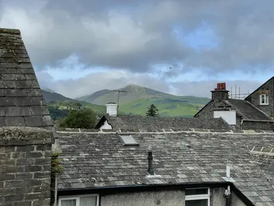 a group of roofs with mountains in the background at Grisedale Pike in Keswick