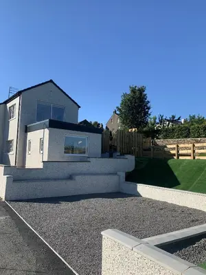a white house with a fence in front of it at Luxury Cottage, views of the Lakes with Hot Tub in Cockermouth