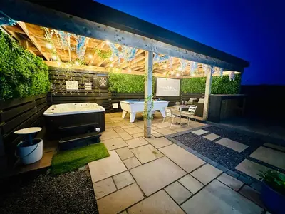 a patio with a table and a grill at Bothy Farm Stay Sleeps 2 HotTub and Pool Table Children Welcome Ayrshire Rural Retreats in Newmilns
