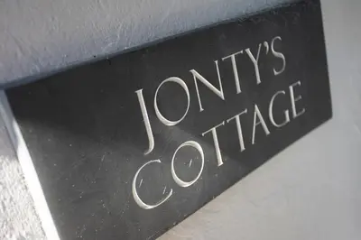 a black sign with the words lyons office at Jontys Cottage in Ambleside