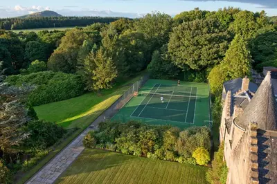 an aerial view of a tennis court in a garden at Glenapp Castle in Ballantrae