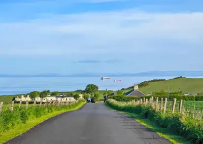 an empty road in a village with at Heads Of Ayr Holiday Park in Ayr