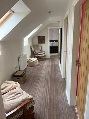 a room with a bed and a living room at The Dairy in Castle Douglas