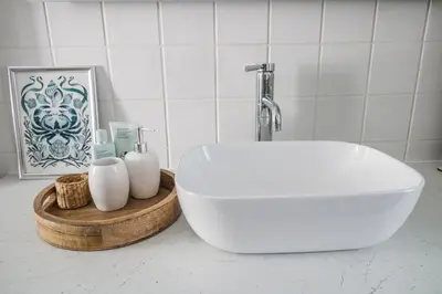 a bathroom with a white tub and a sink at 3 Clarks Terrace in Maryport