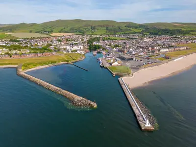 an aerial view of a beach with a town at Kitty's Cottage in Girvan