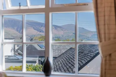 a window with a view of a mountain view at Cottage 9 Old Farmhouse Braithwaite in Keswick