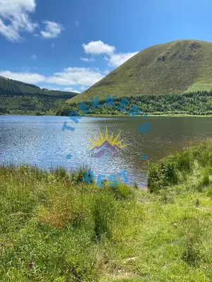 a lake with a painting on the side of it at Trekkers Rest, Brigham, Cockermouth, Cumbria in Cockermouth