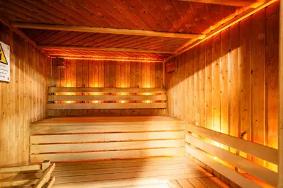 an empty wooden sauna with wooden floors and wooden walls at Bowscale Suite in Penruddock