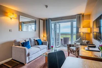 a living room with a couch and a table at Bowscale Suite in Penruddock