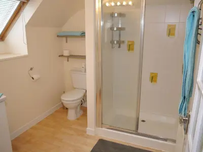 a bathroom with a shower and a toilet at Arakhova in Kirkcudbright