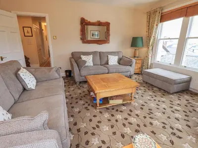 a living room with two couches and a coffee table at Peak View in Keswick