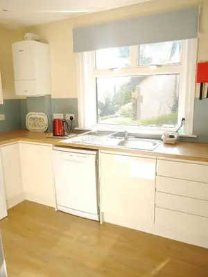a kitchen with a sink and a window at Springfield in Dalbeattie