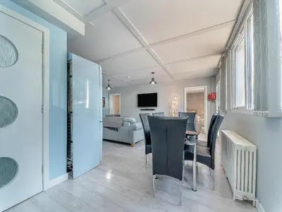 a living room and dining room with a table and chairs at 3 Ladyknowe Uk39969 in Moffat