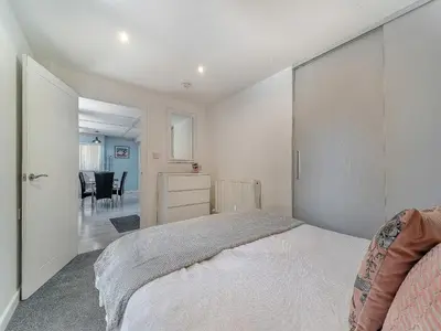 a bedroom with a bed and a dining room at 3 Ladyknowe Uk39969 in Moffat