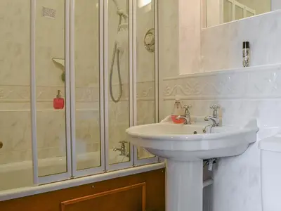 a bathroom with a sink and a shower at Middle Howe in Portinscale