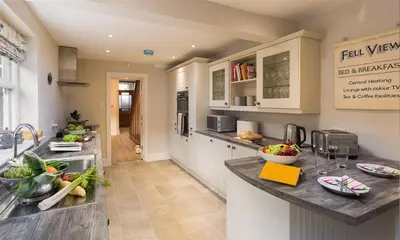 a kitchen with a sink and a counter top at Thirty Blencathra Street in Keswick