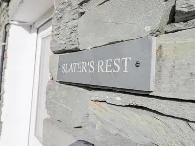 a sign on the side of a stone building at Slaters Rest in Chapel Stile