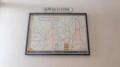 a framed map on a wall with a sign at Bowderstone in Keswick
