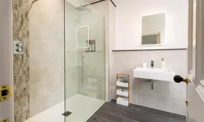 a bathroom with a shower and a sink at Ben House in Grasmere