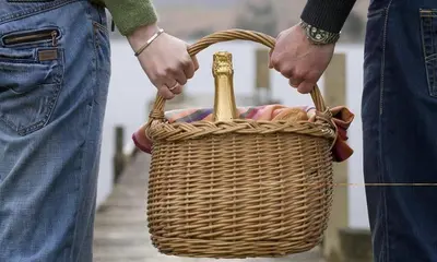 a person holding a wicker basket in their hands at Heathfield in Keswick