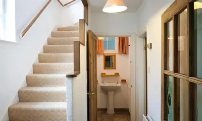 a stairway with a toilet in a room at White Lion Cottage in Chapel Stile