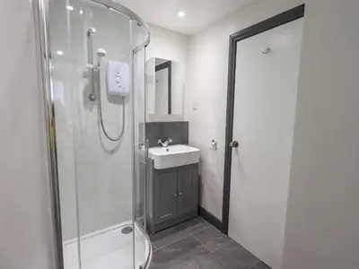 a bathroom with a shower and a sink at Easedale in Grasmere