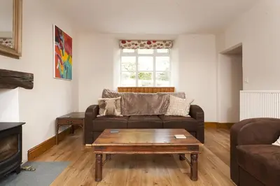 a living room with a couch and a coffee table at Wythebank in Ambleside