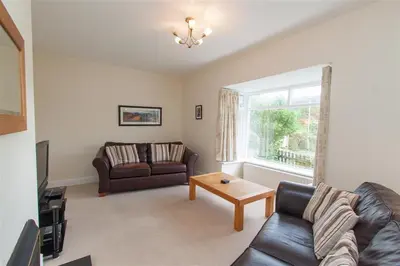 a living room with a couch and a table at The Haven in Keswick