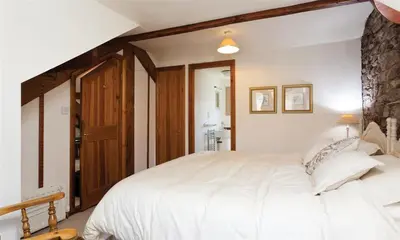 a bedroom with a large white bed in a room at High Raise in Grasmere