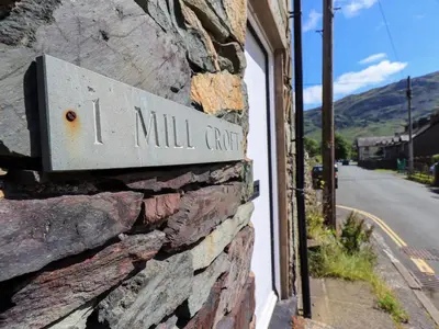 a sign on the side of a stone building at Bleaberry Cottage in Penrith