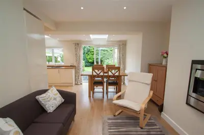 a living room with a couch and a table at Fell End in Keswick