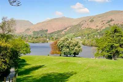 a view of a river with mountains in the background at The Gallery in Grasmere