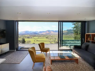 a living room with a couch and a table at Gillside in Keswick