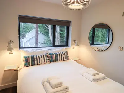 a bedroom with a bed with two towels on it at Gillside in Keswick