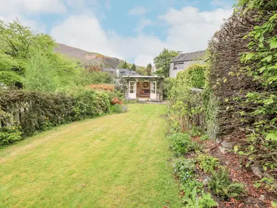 a yard with a house in the background at Grisedale View in Keswick