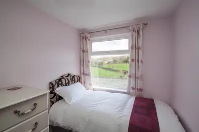 a bedroom with a bed and a window at Mellbreak in Chapel Stile