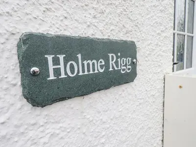 a sign on the side of a building at Holme Rigg in Keswick