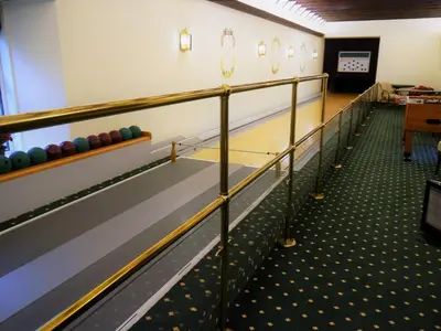a bowling alley with lanes and balls on it at Glenheurie Cottage in Polmood