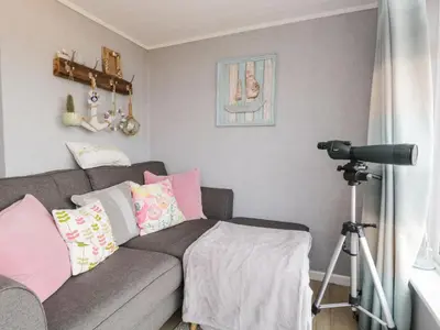 a camera in a living room with a couch at The Chalet in Egremont