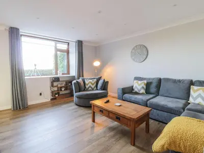 a living room with a couch and a table at Rothiemay in Girvan