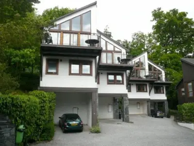 a house with a car parked in front of it at Keswick Bridge 22, within walking distance of Keswick town centre, strictly no pets in Keswick
