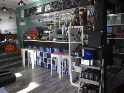 a bar with stools and a counter in a room at Ryans Retreat, Bowness on Solway perfect for a break when walking Hadrians Wall with a hot tub in Bowness-on-Solway
