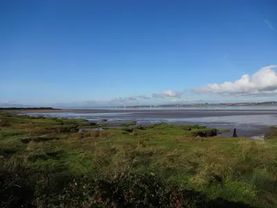 a view of the ocean from a field at Sians Retreat, Bowness on Solway, perfect stop over when walking Hadrians Wall with hot tub in Bowness-on-Solway