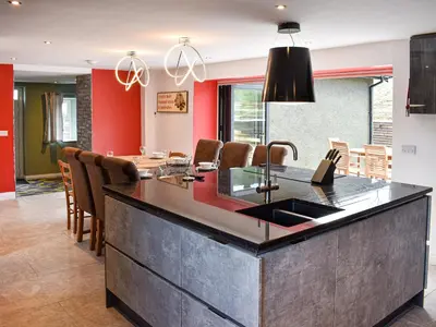 a kitchen with a large island with a sink at Ivy House in Dockray
