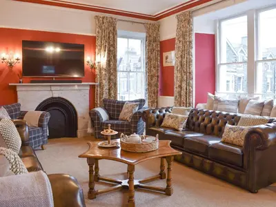 a living room with a couch and a fireplace at Pitcairn House-Uk41255 in Keswick