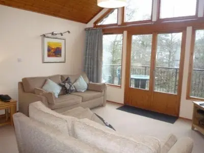 a living room with two couches and a large window at Keswick Bridge 10, within walking distance of Keswick town centre, strictly no pets in Keswick