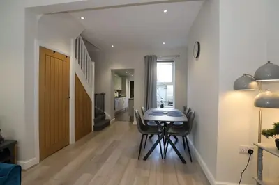 a dining room with a table and chairs at Luxury House Near City Center Hospital &Superstore in Carlisle